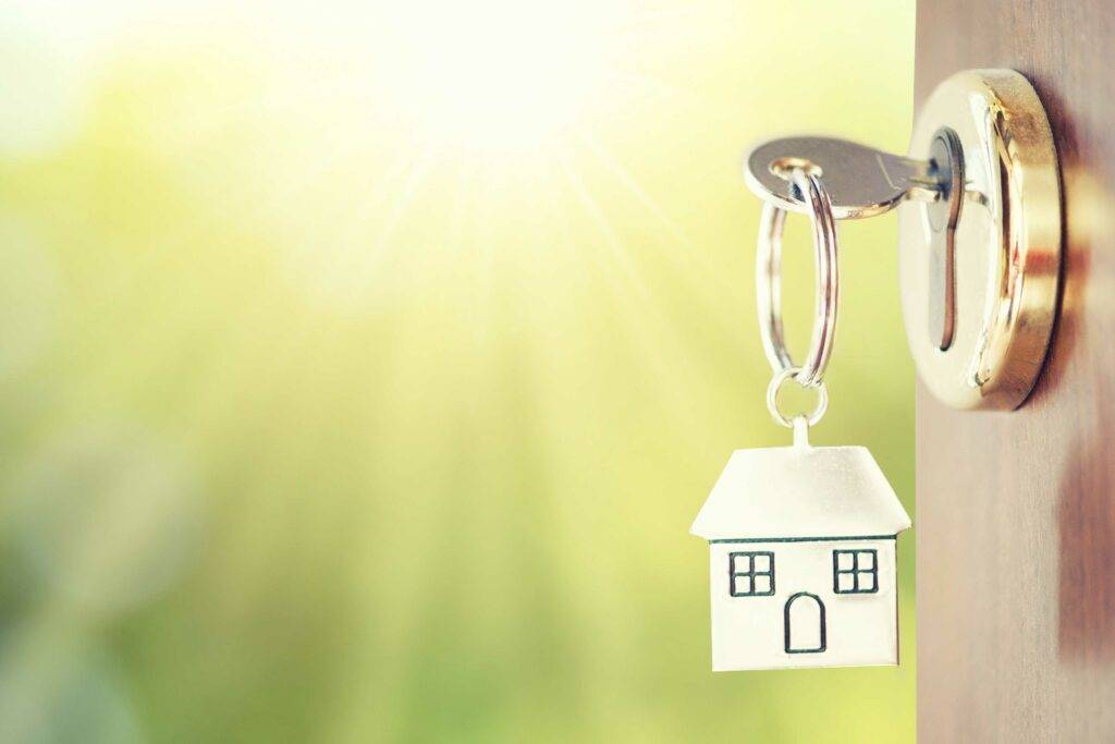key chain with a new home in a door - HOME LOANS